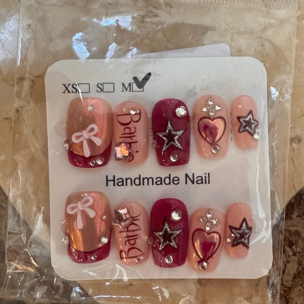 12 New packs of luxury fake nails. 10 to 24 count in each pack. Some 3D nails
